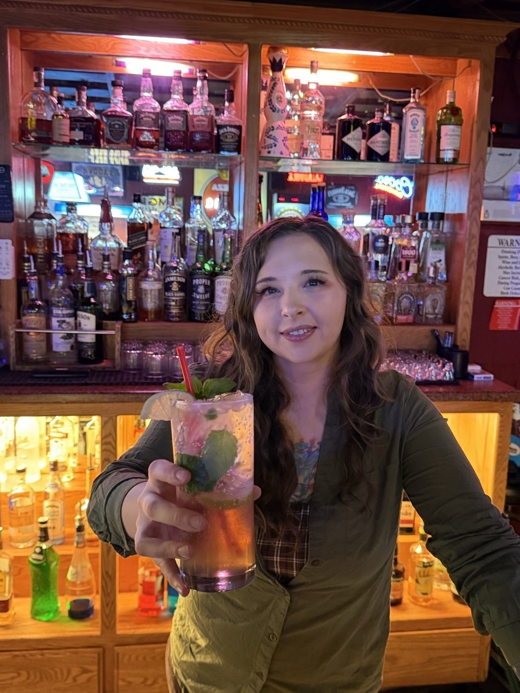 DJ's Pub bartender serving drinks, Ridgecrest CA neighborhood bar
